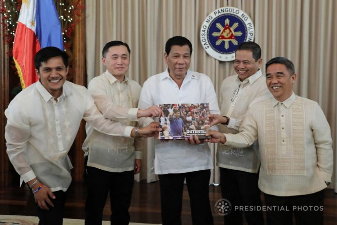 IN BOOK FORM AT LAST. President Rodrigo Duterte poses for a photo with co-authors of the coffeetable book 'Duterte: Journey to the Presidency' John Quineth Rodriguez, Edwin Espejo and Celso Fuentes as the book was presented to the President at the Malacañan Palace on Tuesday evening. Also in the photo is Special Assistant to the President Christopher Lawrence Go. PRESIDENTIAL PHOTO