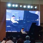 Jovianney Emmanuel Cruz on the piano.