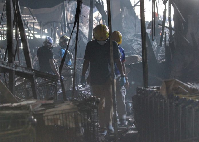 NCCC INSPECTION. Inter-Agency Anti-Arson Task Force members inspect the NCCC mall during an investigation to establish the cause and the origin of the December 23, 2017 fire. Authorities made their last walk-through at the fire scene on Thursday morning before turning it over to the Bureau of Fire Protection rescue personnel as one victim is yet to be found and recovered. LEAN DAVAL JR.