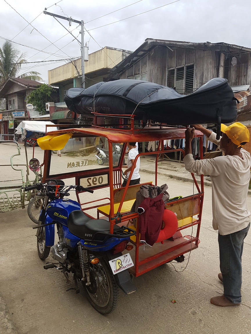 Real struggles of traveling with your surfboard. Taken in Siargao, September 2017