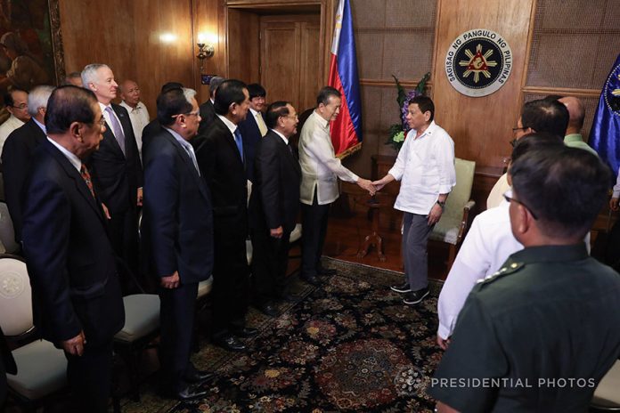 PAYING RESPECTS. President Rodrigo Duterte greets the members of the Pinnacle Club of ASEAN who paid a courtesy call on him at Malacañan Palace on Wednesday. PRESIDENTIAL PHOTO