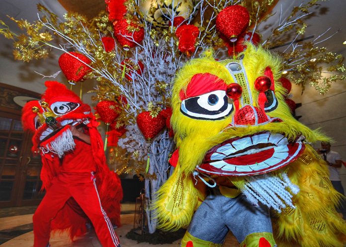 LION DANCE. Performers of traditional lion dance open the Chinese New Year celebration at the Marco Polo Davao on Thursday night. LEAN DAVAL JR