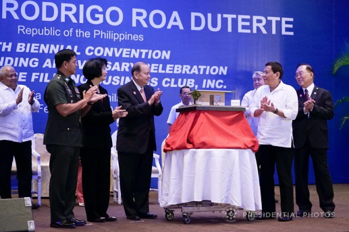 HOUSING MODEL. President Rodrigo Duterte applauds after the presentation of the miniature-housing model of the ‘Bahay Pag-Asa Phase II Project’ in Marawi City during the 10th Biennial National Convention and 20th Founding Anniversary Celebration of the Chinese Filipino Business Club, Inc. (CFBCI) at the Manila Hotel on Monday evening. Also in the photo are Executive Secretary Salvador Medialdea, Philippine Army Commander Lieutenant General Rolando Bautista, project coordinator Dr. Isabel Cojuangco-Suntay, project donor and Special Envoy to China Carlos Chan and CFBCI President William Yap. PRESIDENTIAL PHOTO