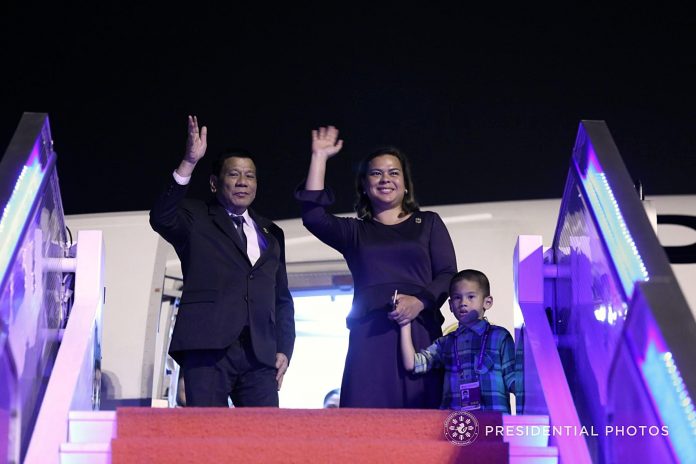 President Rodrigo Duterte and Davao City Mayor Sara Duterte-Carpio wave farewell to the send-off party as they prepare to board the Philippine Airlines Charter Flight PR001 at the Qionghai Boao International Airport on Tuesday night following a successful participation to the Boao Forum for Asia (BFA) Annual Conference 2018. Also in the photo is the President’s grandson Mateo. PRESIDENTIAL PHOTO