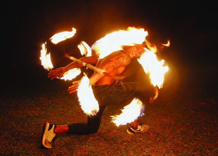 A poi dancer performs fire dance routine at Eden Nature Park as part of the resort’s featured activities and entertainment during the opening night of its ‘Summer Glamping’ which is scheduled in all Saturdays of April and May. LEAN DAVAL JR.
