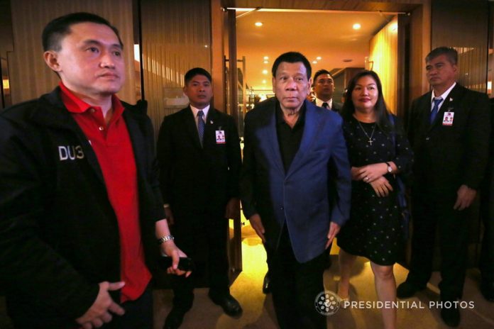 President Rodrigo Duterte is accompanied by his partner Honeylet upon his arrival at the Harbourview Hong Kong for a dinner with some friends from Hong Kong on Wednesday. Also in the photo is Special Assistant to the President Christopher Lawrence Go. PRESIDENTIAL PHOTO