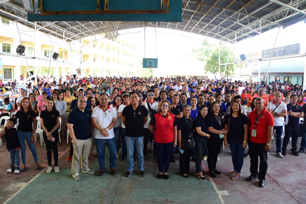 Modern Bayanihan: Davao Light employees cover books and install safety ...