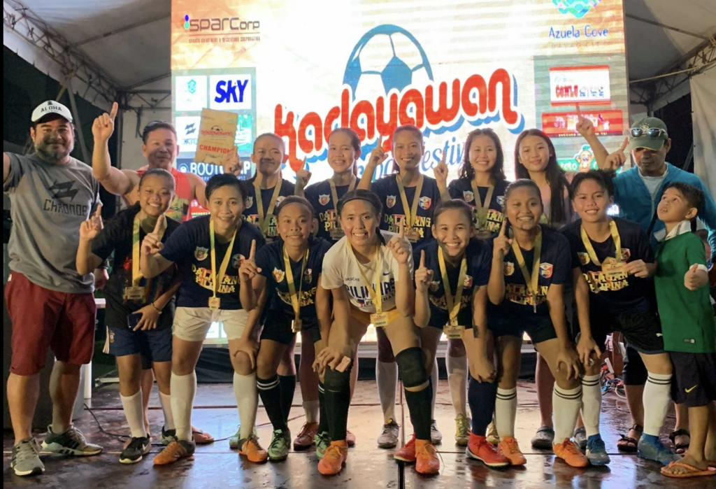 The Dalagang Filipina squad of Cotabato City won the women;s title of the 2019 Kadayawan Football Festival. At left is organizer Buboy Arrieta.