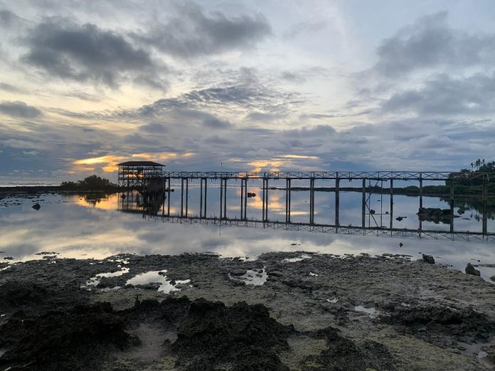 The iconic Cloud 9 boardwalk in Siargao Islands, Surigao del Norte during sunrise months before it was washed away by strong waves brought about by Typhoon Odette. The world-class surfing destination in the Philippines and one of the 2021 Times’ World Greatest Places is reopening to tourists today (February 25), starting in Del Carmen town. Edge Davao