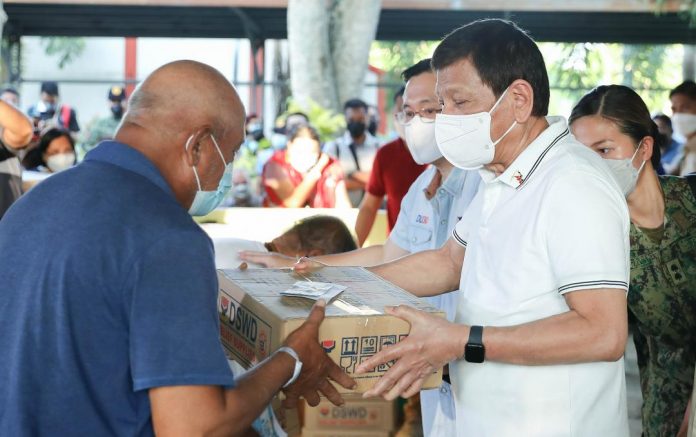 President Rodrigo Duterte, accompanied by Social Welfare Secretary Rolando Joselito Bautista and Senator Christopher 