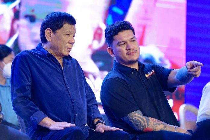 President Rodrigo Duterte interacts with his son, mayoral aspirant Sebastian 