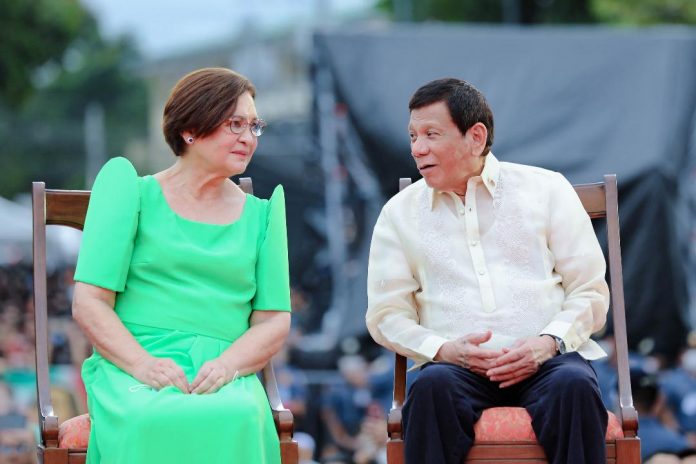 President Rodrigo Duterte interacts with ex-wife Elizabeth Zimmerman during the inauguration of their daughter, Vice President-elect Sara Duterte at San Pedro Square in Davao City last Sunday. The outgoing President has declined serving as the drug czar of his successor President-elect Ferdinand 