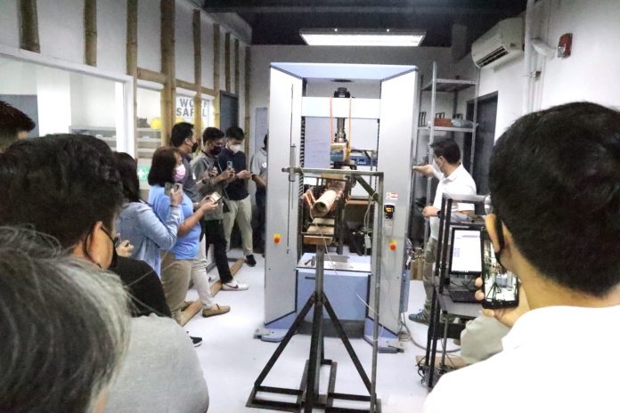 At the Base Innovation Center in Makati, Head of Technology Luis Felipe Lopez Munoz demonstrates the use of the specially developed Universal Testing Machine