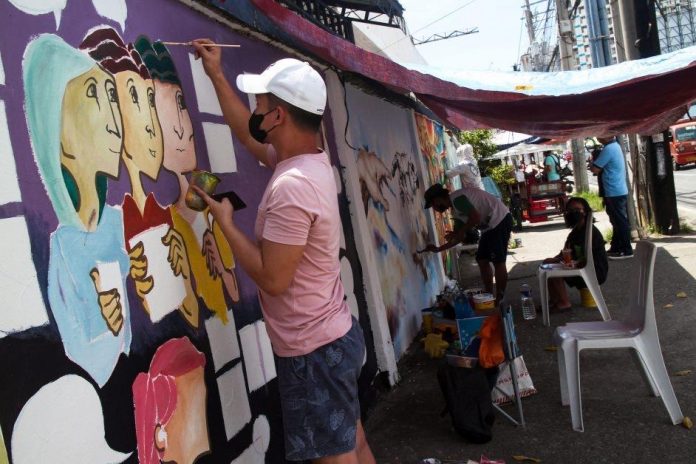 Artists participate in the mural painting contest on October 21, 2022 in downtown Davao City. The activity is part of the Department of Trade and Industry’s celebration of Consumer Welfare Month. Mindanews Photo