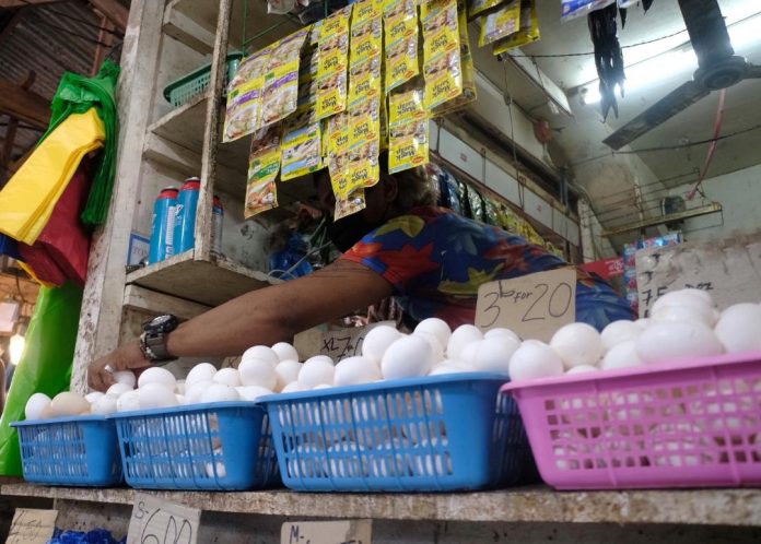 A vendor arranges fresh eggs at a store at Agdao Public Market in Davao City. The Philippine Egg Board Association said bird flu, low production and an increase in feed prices were the factors that led to the recent rise in egg prices. Lean Daval Jr.