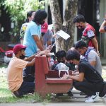 Registrants fill up forms at the Commission on Elections office in Davao City on Tuesday (13 December 2022), the second day of registration for new voters. The registration is until 31 January 2023. MindaNews Photo