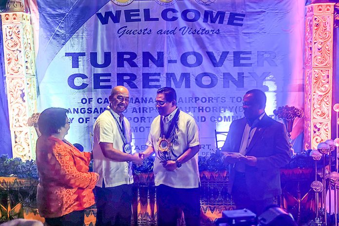 Chief Minister Ahod Ebrahim (middle) and retired Brig. Gen. Dionisio Robles, of the Civil Aviation Authority of the Philippines (CAAP), during turnover ceremonies of the six BARMM airports on Wednesday (10 January 2023). MindaNews photo by FERDINANDH CABRERA