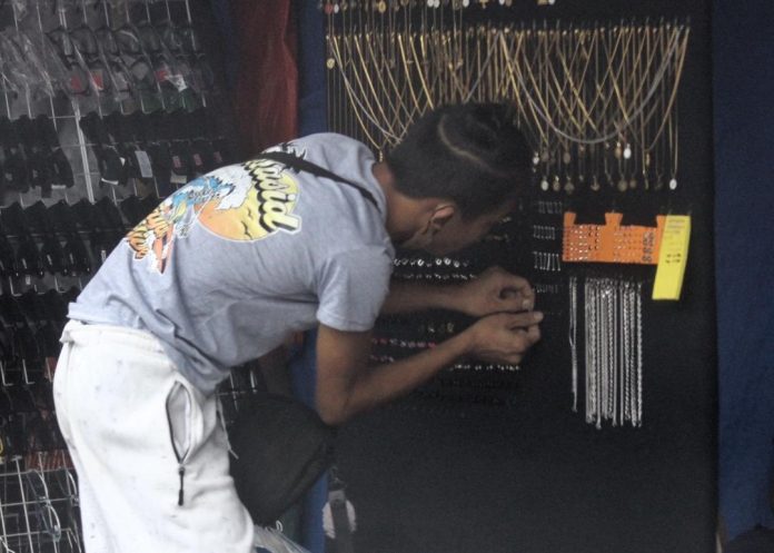 A street vendor displays handcrafted accessories made from stainless steel along San Pedro Street in Davao City on Monday. LEAN DAVAL JR.