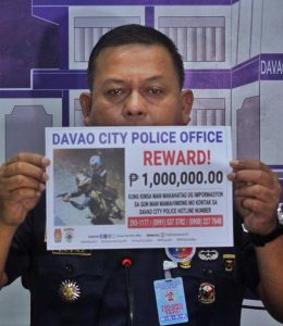 Davao City Police Office (DCPO) director Colonel Alberto Lupaz shows a "wanted" reward poster of the suspects for the killing of Yvonette Chua Plaza during a presser at Camp Domingo Leonor on Tuesday. A group of individuals is offering a P1 million reward for any information that will lead to the arrest of the suspects. Lean Daval Jr.