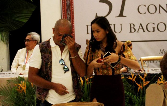 Anthony Ajero Jr. sheds tears as he can't control his emotion before receiving the Datu Bago award for his father, the late Antonio Ajero, during the 51st Conferment of Datu Bago Awards 2023 held at The Royal Mandaya Hotel in Davao City on Wednesday. Ajero, who's considered as Davao's dean of journalism, was awarded the posthumous Datu Bago award to recognize his contributions to the local media industry. LEAN DAVAL JR.