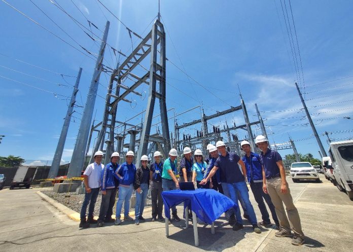 Davao Light and Power Company (DLPC) president and chief operating officer Engr. Rodger Velasco (center), DLPC Substation and Electrical Equipment head Engr. Arnel Bersabe (4th from left), DLPC Reputation Enhancement Department head Fermin Edillon (rightmost), Davao City Third District Councilors Myrna Dalodo-Ortiz (5th from right) and Alberto Ungab (5th from left) lead the switching on ceremony to mark the inauguration of the company's new digital substation in Binugao, Toril, Davao City on Thursday. The Binugao substation aims to address the growing demand for electricitt in the southern part of the city. LEAN DAVAL JR.