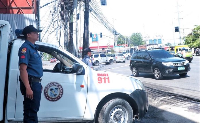 Police officers from the Mobile Patrol Unit of the Davao City Police Office (DCPO) stand guard along Lanang, Davao City on Tuesday. Police station commanders in Davao City were told to achieve Philippine National Police (PNP) chief General Benjamin Acorda Jr.’s order of 3-minute response time to crime incidents. LEAN DAVAL JR.