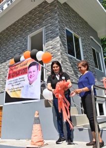 Davao City First District Representative Paolo Duterte's wife, Catalunan Grande barangay captain January Duterte, leads the cutting of the ribbon and turn over of a day care center funded by the congressman in Barangay Langub, Ma-a, Davao City on Friday. Barangay captain Duterte, who also turned over a multi-purpose building project of Rep. Duterte in the said barangay, was joined by Barangay Langub chieftain Leilani Bacalso.