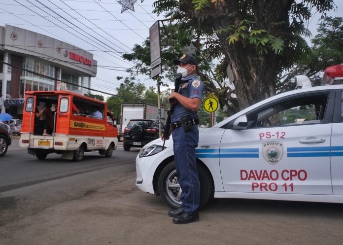 A police personnel stands guard along J.P. Laurel Avenue in Davao City. Police station commanders in Davao City were ordered to intensify efforts in crime prevention and patrolling operations particularly in crime-prone areas in Davao City. LEAN DAVAL JR