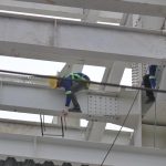 Workers work on the metal structure of a high-rise building that is being constructed along Quimpo Boulevard in Davao City on Wednesday. The country is leading among surveyed Southeast Asian countries in plans to adopt data strategy in the construction industry, according the a research conducted by a leading global provider of construction management software. LEAN DAVAL JR.