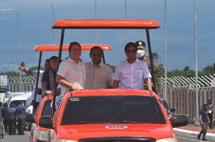 President Ferdinand Marcos Jr. leads the drive-thru inauguration of the Davao City Coastal Bypass Road's Bago Aplaya-Tulip Drive (Times Beach) segment in Davao City on Saturday. With him are Vice President Sara Duterte, Mayor Sebastian Duterte, Senator Imee Marcos, and Department of Public Works and Highway (DPWH) Secretary Manuel Bonoan. LEAN DAVAL JR