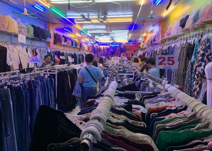 Shoppers choose from a wide collection of secondhand items at a store along Ilustre Street on Monday night. LEAN DAVAL JR