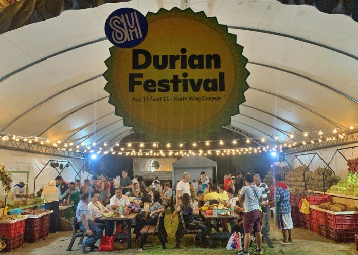 Mall goers gather to feast on different varieties of durian and other fruits that are abundant in Davao during the opening of SM Lanang Premier's Kadayawan Durian Festival 2023 on Friday. LEAN DAVAL JR