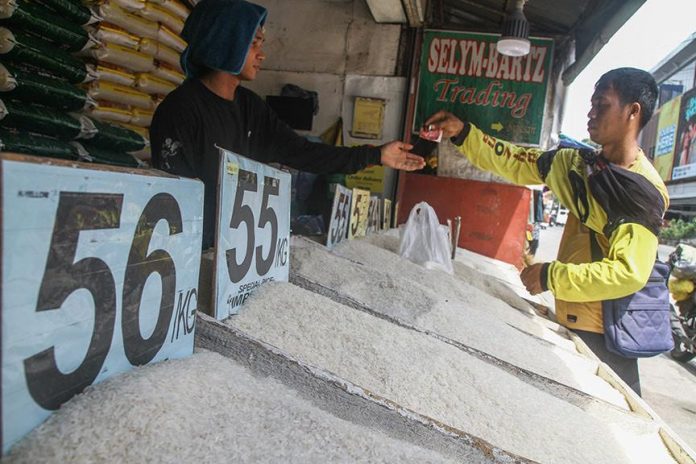 A man buys a kilo of rice at a retailer store in Buhangin, Davao City on Tuesday (5 September 2023). As of Tuesday morning, many of the rice retailers in the city have yet to make price adjustments as provided by Executive Order 39 that sets the price ceiling for regular milled rice at P41 per kilo and P45 a kilo for well-milled rice nationwide. MindaNews photo