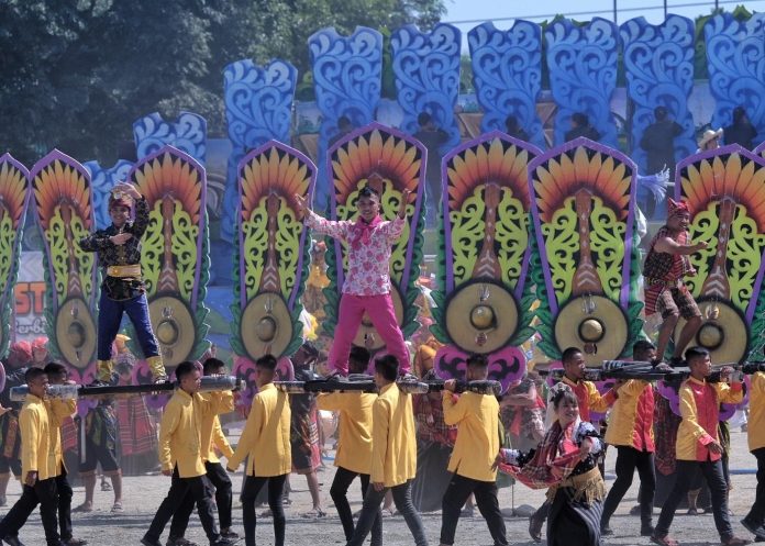 Participants from the Municipality of Tulunan perform during this year's Kalivungan Festival street dancing competition held at the Provincial Capitol grounds in Amas, Kidapawan City on Friday. The municipality took home P1 million after winning the competition. LEAN DAVAL JR.