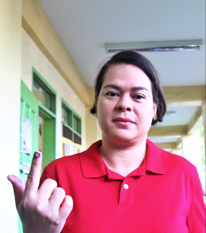 Vice President and Education Secretary Sara Duterte shows her index finger marked with indelible ink after casting her vote for the 2023 Barangay and Sangguniang Kabataan Elections (BSKE) at Daniel R. Aguinaldo National High School (DRANHS) in Matina Crossing, Davao City on Monday. LEAN DAVAL JR