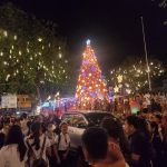 Dabawenyos gather at Quezon Park as the giant Christmas tree and the Christmas installations illuminate the City Hall area after Mayor Sebastian "Baste" Duterte officially opened this year's Pasko Fiesta on Tuesday evening. LEAN DAVAL JR