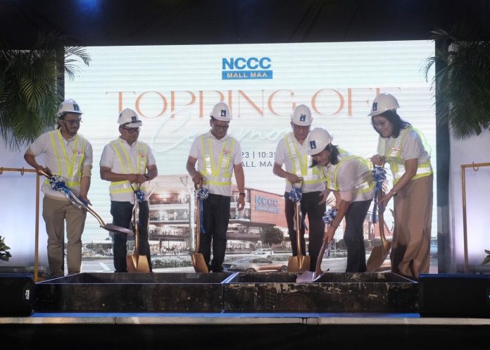 NCCC Group of Companies chair Helen Lim, NCCC Malls president Sharlene Lim, D.M. Consunji Inc.'s (DMCI's) George Consunji, DMCI's Joffrey Gacula, ACPAMA's Ademar Pama and ASYA Design's Christpherson Harina lead the topping off of the 4-storey NCCC Mall Ma-a on Wednesday. LEAN DAVAL JR