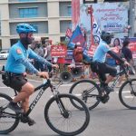 Davao City Police Office (DCPO) bicycle squad members pedal pass a protest action staged by progressive groups to express their opposition to the government's public utility vehicle modernization program at Freedom Park along Roxas Avenue in Davao City on Wednesday. The rally coincided with a city-wide transport strike, which failed to paralyze the public transport in the city. LEAND DAVAL JR