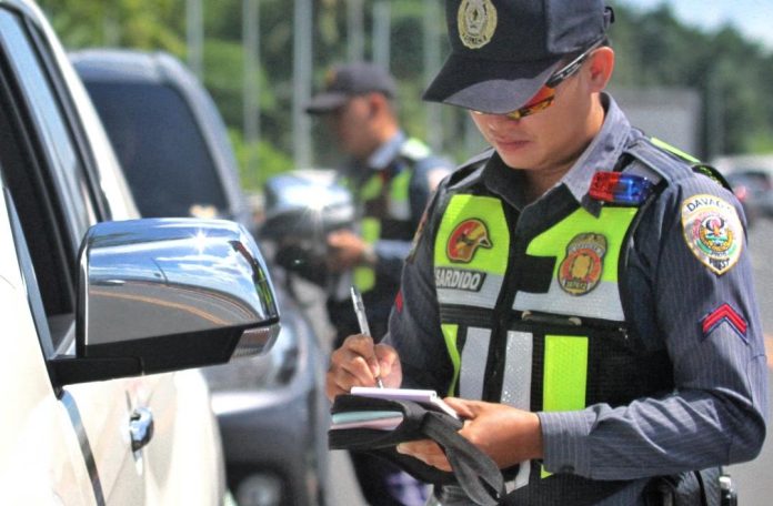 Davao City Police Office-Traffic Enforcement Unit (DCPO-TEU) operatives apprehend speed limit violators along Davao City Bypass Coastal Road during the first day of implementation of the new Davao City Speed Limit Ordinance on Thursday. LEAN DAVAL JR