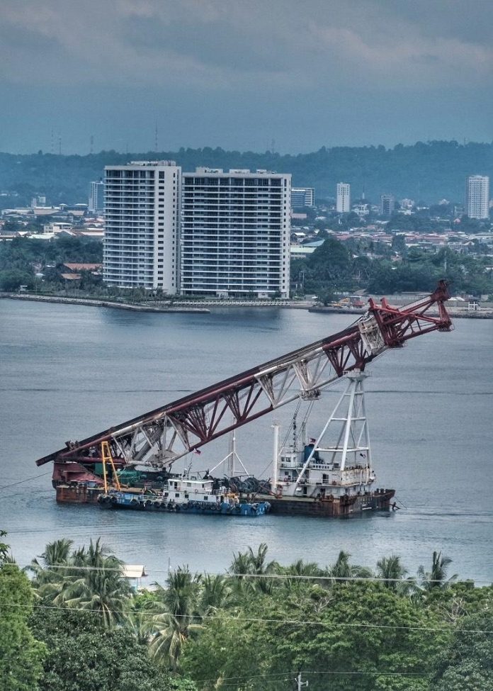 A dredging barge is moored near a beachfront where the landing site of the Samal Island-Davao City Connector (SIDC) Project in the Island Garden City of Samal (IGaCoS) is located. LEAN DAVAL JR