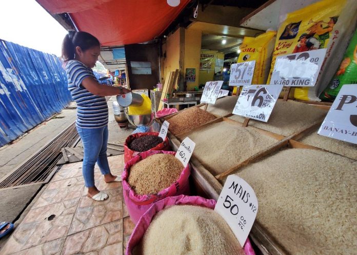 A trader prepares commercial rice for a customer at Agdao Public Market in Davao City. September inflation is expected to settle within 2 percent to 2.8 percent, according to the Bangko Sentral ng Pilipinas (BSP). LEAN DAVAL JR