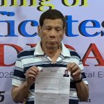 Former President Rodrigo Duterte files his certificate of candidacy (COC) for mayor of Davao City at the Commission on Elections (COMELEC) field office inside Magsaysay Park in Davao City on Monday. LEAN DAVAL JR