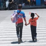 A father, together with his daughter, crosses the usually busy San Pedro Street after fetching the latter from school in Davao City. The City Council of Davao has passed the Solo Parents’ Ordinance of Davao City on Tuesday. The Implementing Rules and Regulations (IRR) that will ensure the effective implementation of the said ordinance was already issued by the city government of Davao last month. LEAN DAVAL JR