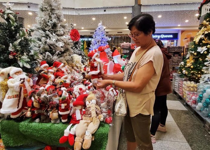 Miniature Santa Claus and other Christmas items are sold at a mall along J.P. Laurel Avenue in Davao City on Wednesday. LEAN DAVAL JR