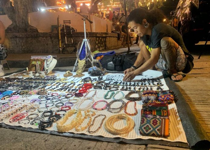 Handcrafted native items are being displayed by a vendor near Quezon Park in Davao City where hundreds of Dabawenyos gather to witness the city's Christmas installation on Friday. LEAN DAVAL JR