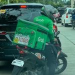 A delivery rider maneuvers through a congested street in Davao City. Delivery riders in the city is step closer to be exempt from business permit requirement after an amendment to the ordinance that will no longer require them to obtain a business permit was passed on the second reading by the City Council on Tuesday. LEAN DAVAL JR