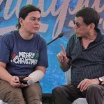 Former President Rodrigo Duterte confers with his daughter, Vice President Sara Duterte, during the annual "Pahalipay sa Taal" gift-giving near the ancestral home of the Duterte family in Taal, Central Park Subd., Bangkal, Davao City on Christmas Day. The former president appealed to the Dabawenyos to continue supporting him and his children in their political journey. LEAN DAVAL JR