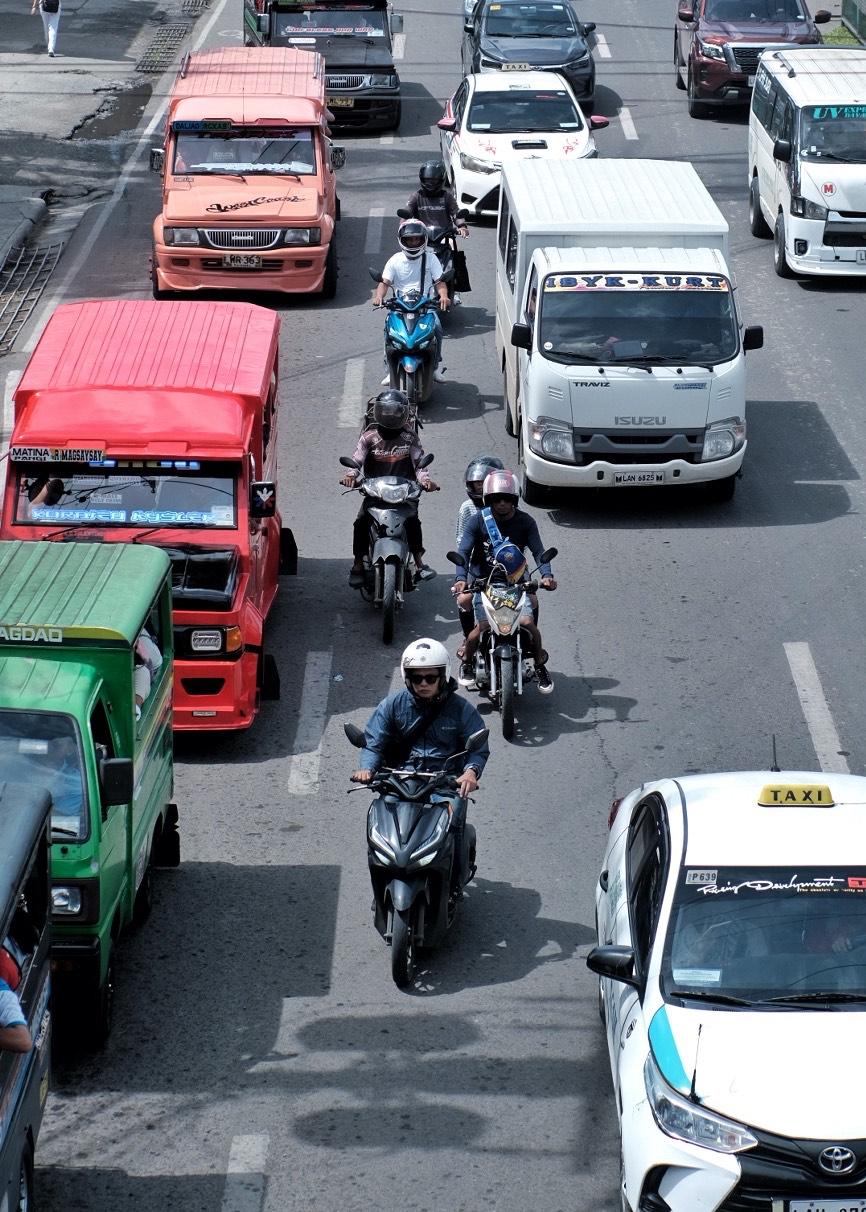 Motorcycle riders maneuver through traffic along MacArthur Highway in Matina, Davao City where three big schools are located. Land Transportation Office 11 (LTO 11) said that 60% to 70% of vehicles running in the streets of Davao Region are unregistered and majority are motorcycles. LEAN DAVAL JR